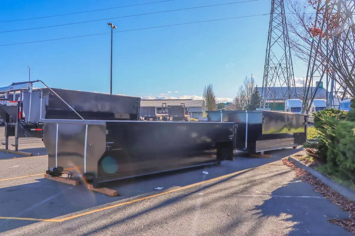 Roll-off dumpster ready for waste disposal at job site for Demolition Dumpster Rental in Winona Lake